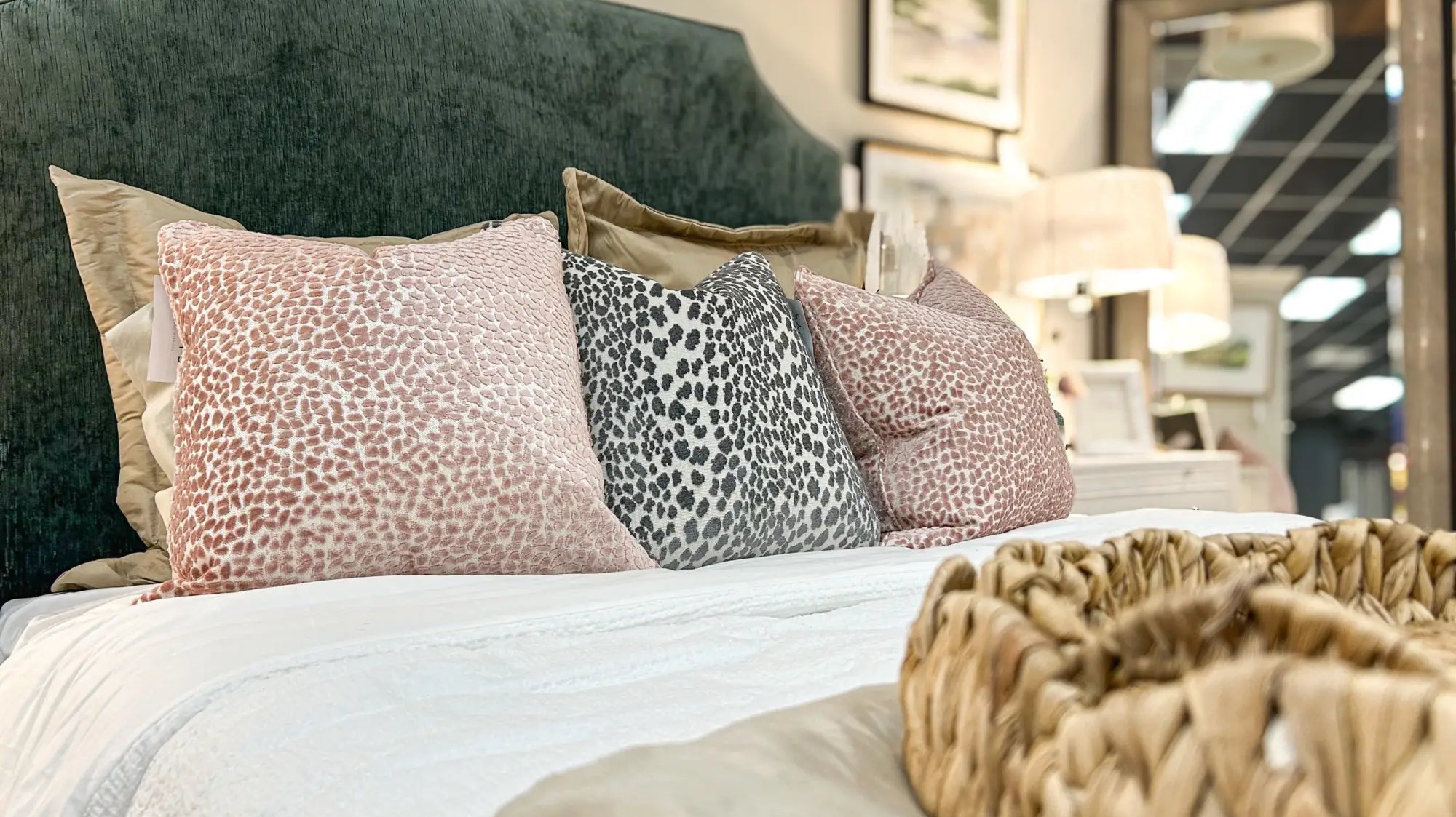 Pink, blue, and greens tied into a cozy bedroom design.