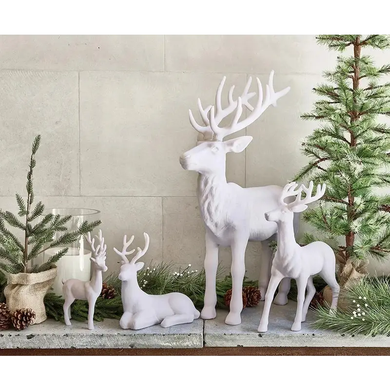 Sitting White Flocked Deer - reindeer