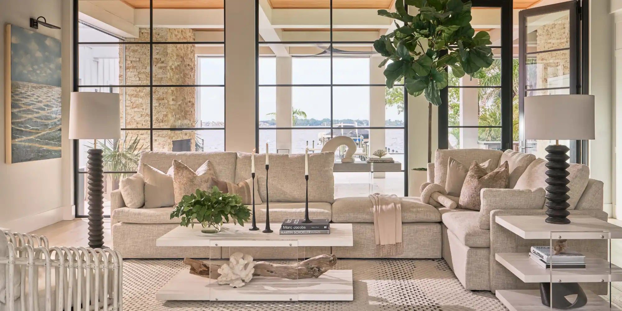 Beige sectional sofa with throw pillows and a draped blanket.