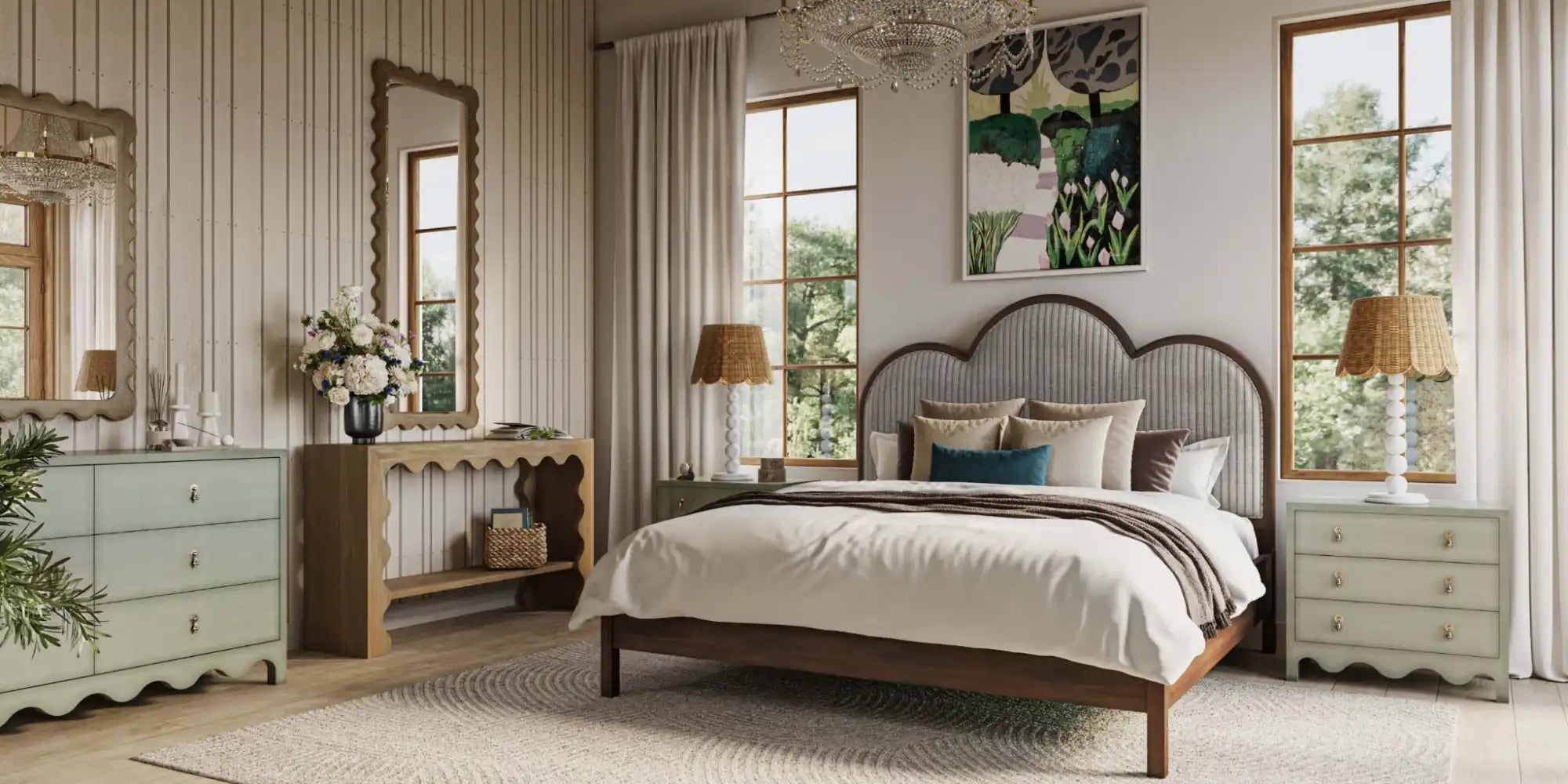 A cozy bedroom with a cloud-shaped headboard and elegant scalloped furniture.