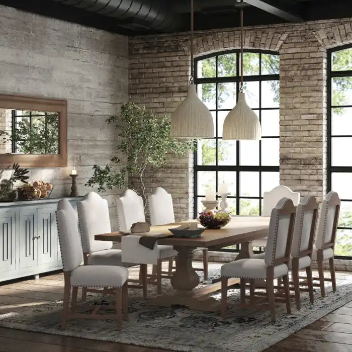 Rectangular wooden dining table with eight upholstered chairs