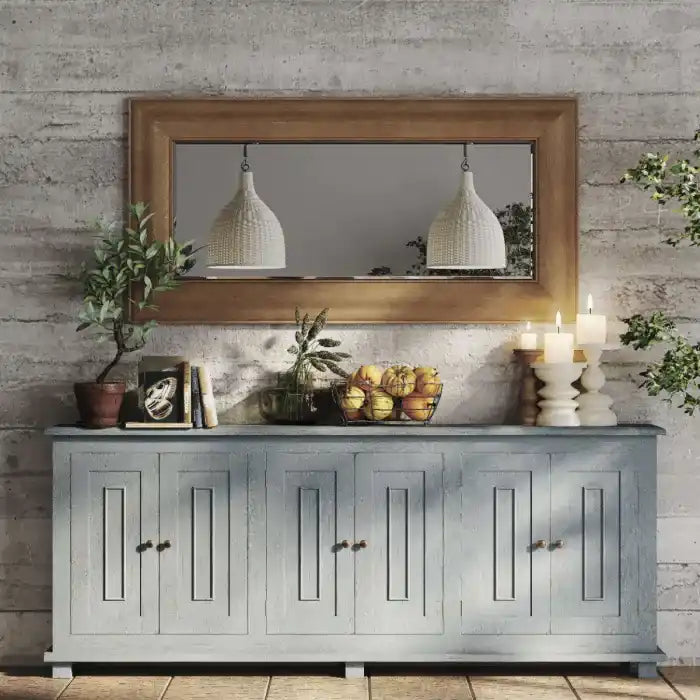 Rustic wooden console table with four doors and rectangular paneling.